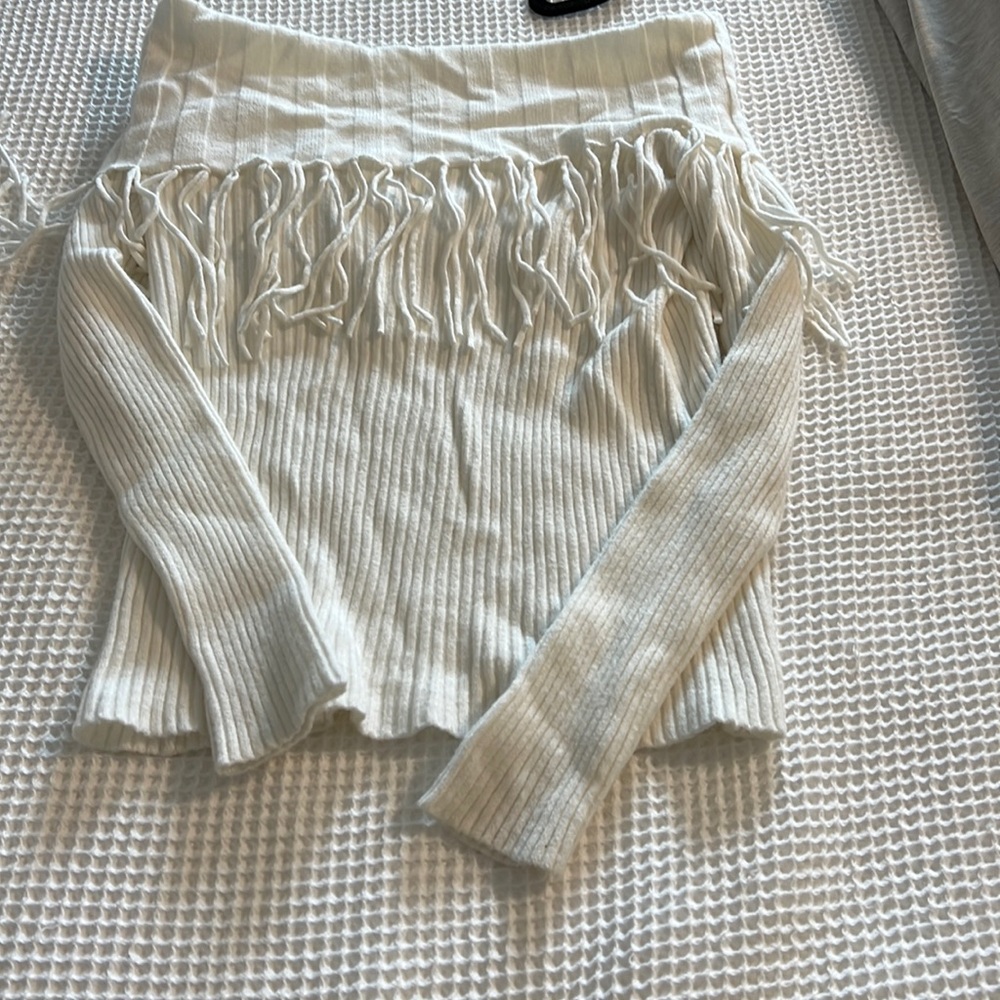 Off the shoulder Vici sweater with fringe detail